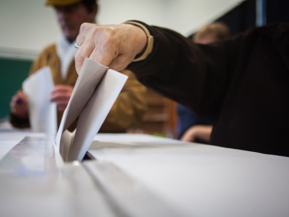 Closeup of person voting at polling station