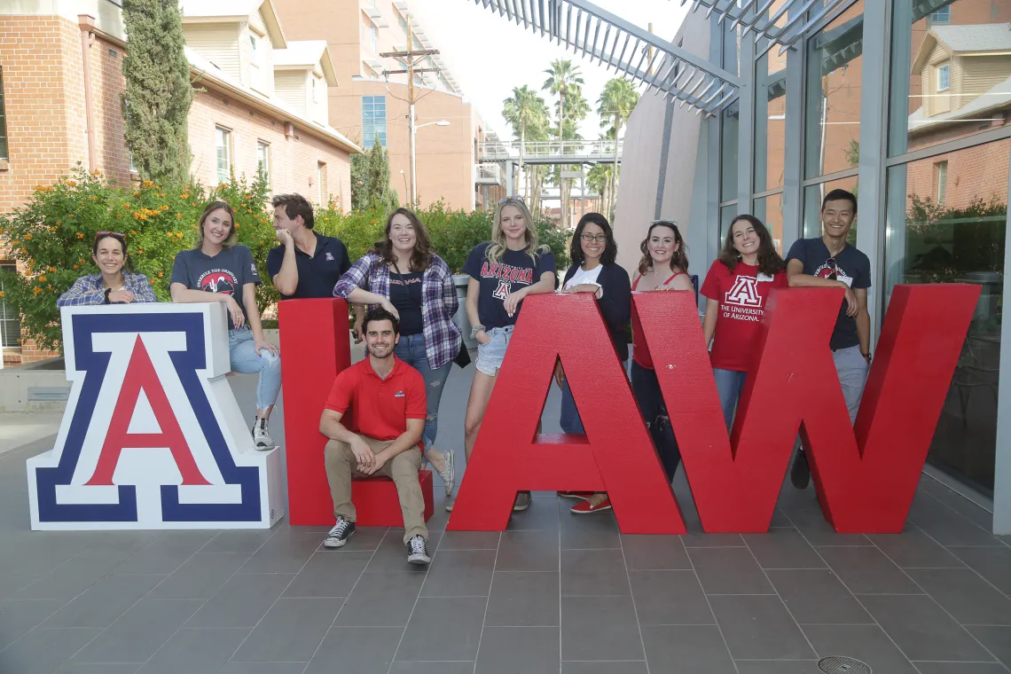 Students posing around A LAW large letters Students posing around A LAW large letters